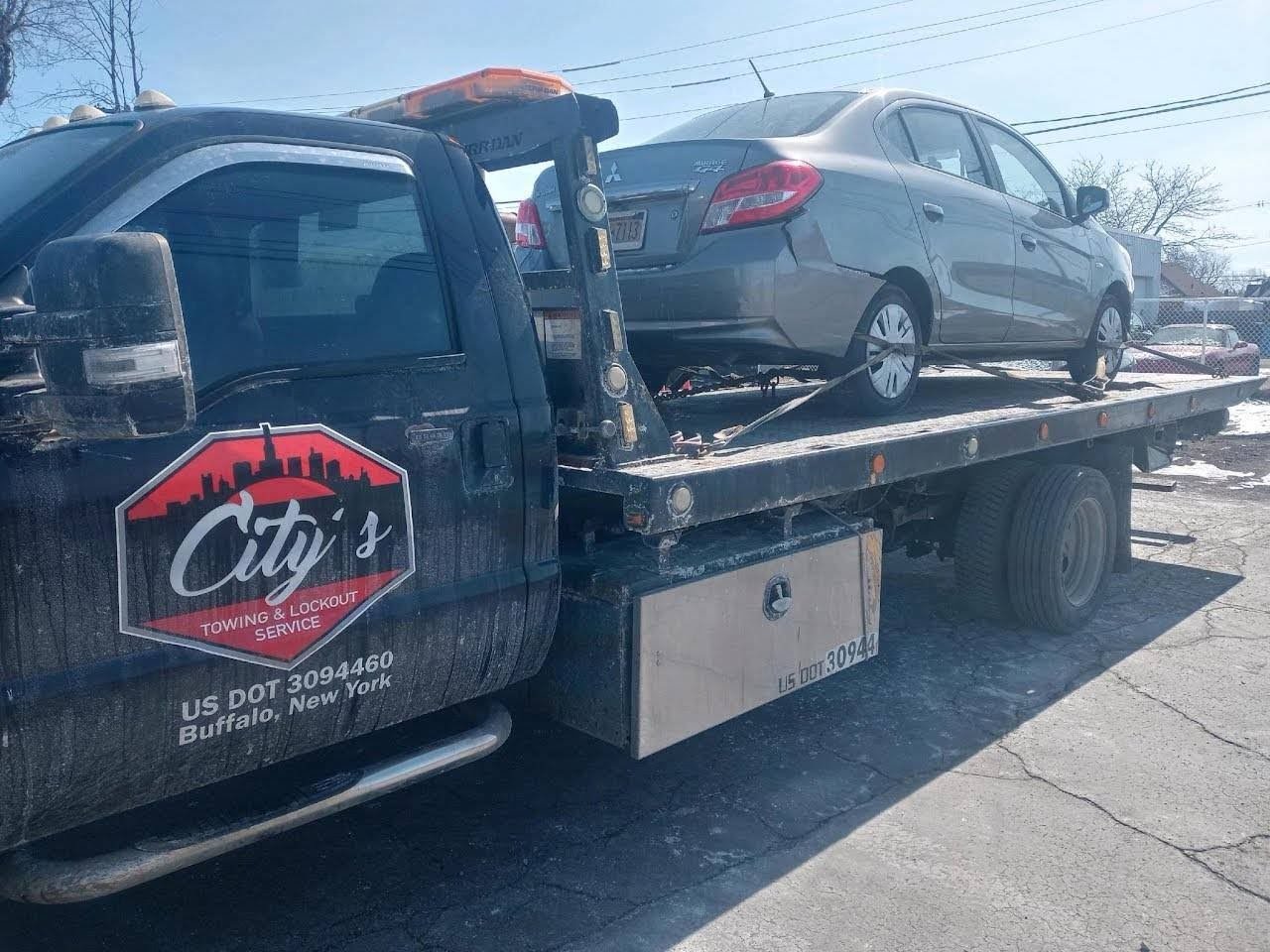 City's Towing branded flatbed truck in Buffalo NY
